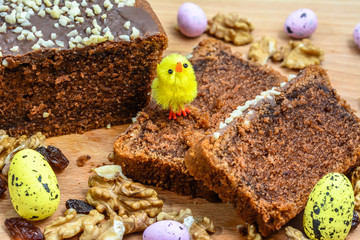 Easter cake with delicacies and easter eggs.
