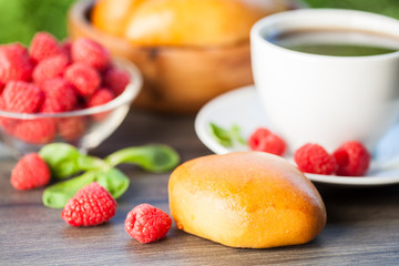 Pie with raspberries on a dark wood background. Selective focus. Natural background.