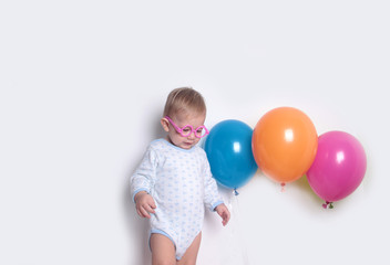 baby with balloons