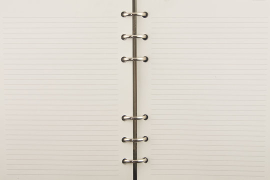 empty notebook with metal ring texture