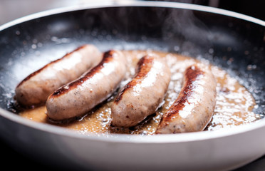 Sausages cooking