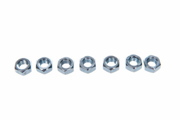 Metal nuts on white background