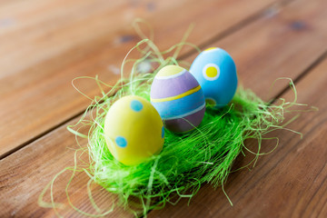 close up of colored easter eggs and grass