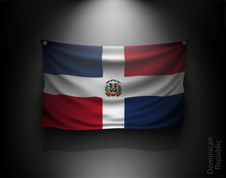 waving flag Dominican Republic on a dark wall 