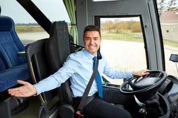 happy driver inviting on board of intercity bus