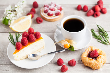 sweet cake with cup of tea on wooden table
