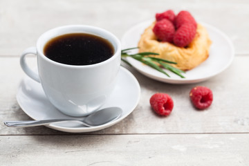 sweet cake with cup of tea on wooden table