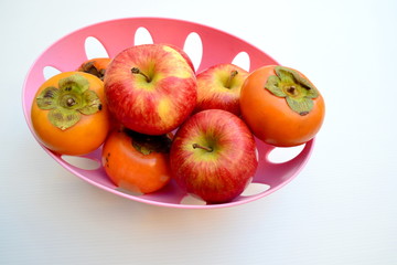 Red Apple and Persimmon in Basket