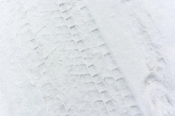 Footprints in the snow from the tire