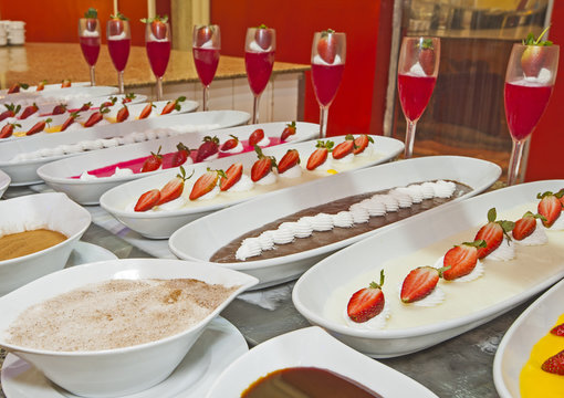 Selection of desserts on display at a restaurant buffet