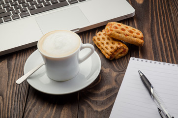 Coffee, Computer and Note Pad