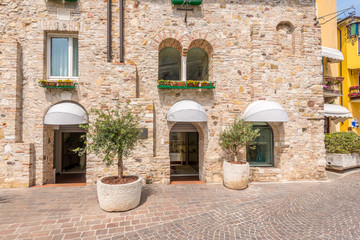 Fototapeta na wymiar Picturesque small town street view in Sirmione, Lake Garda Italy.