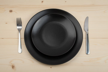 Empty plate on a wooden table