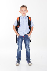 Fototapeta premium Serious school boy isolated on white