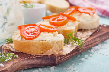 Delicious helpful sandwich with goat cheese and cherry tomatoes