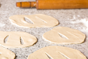 Fototapeta na wymiar Housewife cooking dough