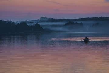 Obraz na płótnie Canvas Fishing boat on the lake in the night