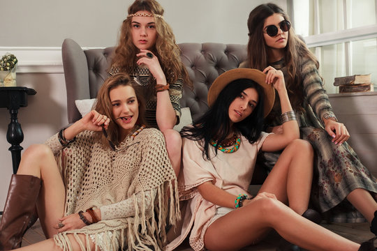 Four Boho style girls at home party