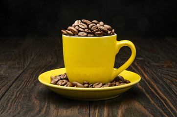 Coffee Beans in a Yellow Cup
