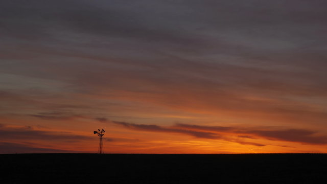 4K Clouds Before Sunrise with Windmill