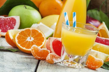 Naklejka na ściany i meble Healthy fresh citrus cocktail in the big glass with striped stra