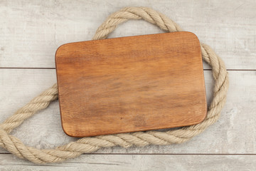 Image of old texture of wooden boards with ship rope.