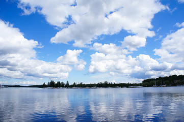 Finland lake with blue sky and clouds