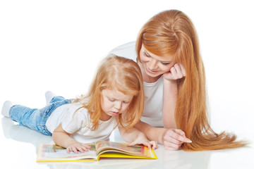 Fototapeta premium Mother with daughter are reading a book