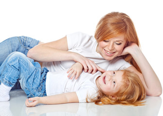 Obraz na płótnie Canvas Mother with daughter in studio, white background 