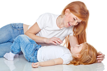 Mother with daughter in studio, white background 