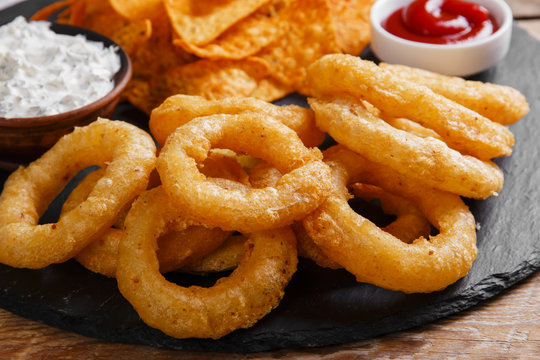 Fried Onion Rings In Batter With Sauce Tortilla Chips