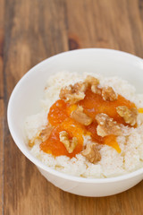 fresh cheese with pumpkin jam and nuts in bowl