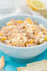 fish salad on blue bowl