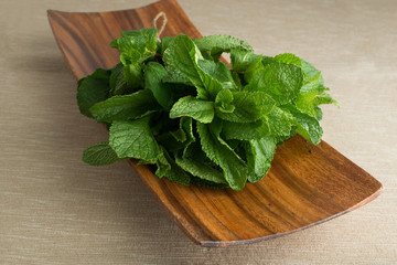bush mint on a wooden plate