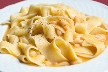 Pasta and beans in the white dish