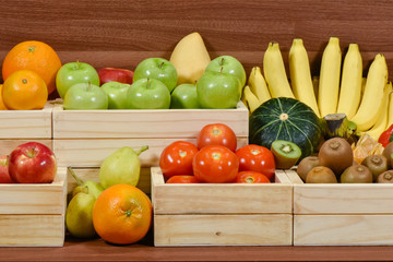 Fresh fruits and vegetables in woodem box at the supermarket