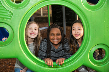 Group of girls playing together at school playground