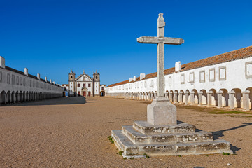 Stone Cross in front of the Church and Pilgrim lodgings of the Sanctuary of Nossa Senhora do Cabo. Espichel Cape, Sesimbra, Portugal