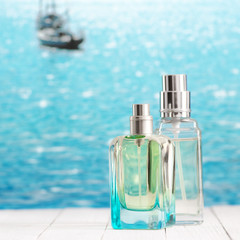 Perfume bottles against sea