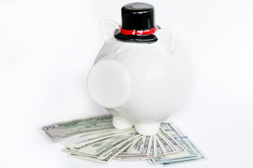 white piggy bank with bowler hat with money on a white background