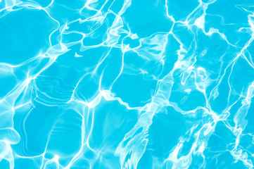 Ripple water surface and sun reflection in swimming pool