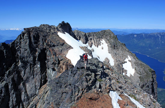 Happy hiker on the ridge of Lady Peak in Cheam Range, Cascade Mountains near Chilliwack, British Columbia, Canada.