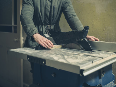 Young person operating tablesaw