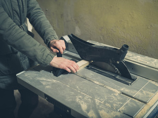 Young person operating tablesaw
