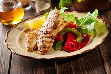 Grilled chicken breasts served with grilled paprika