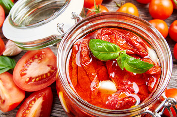 Sun dried tomatoes with olive oil in a jar
