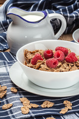 Bowl of cereals with raspberrie.