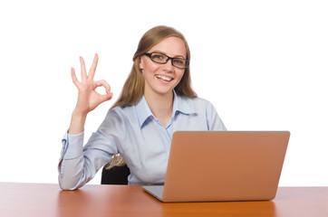 Office employee sitting before laptop isolated on white