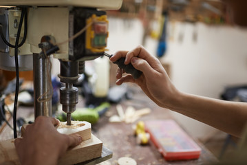 Drilling the wood closeup