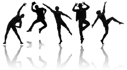 Silhouettes of dancers in dancing concept